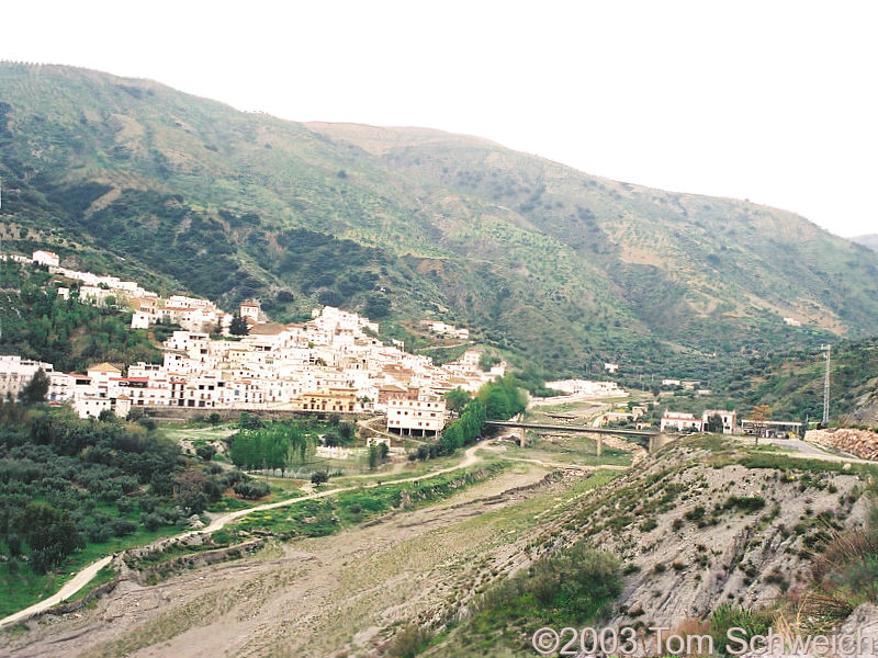 Torvizcon beside its rambla.
